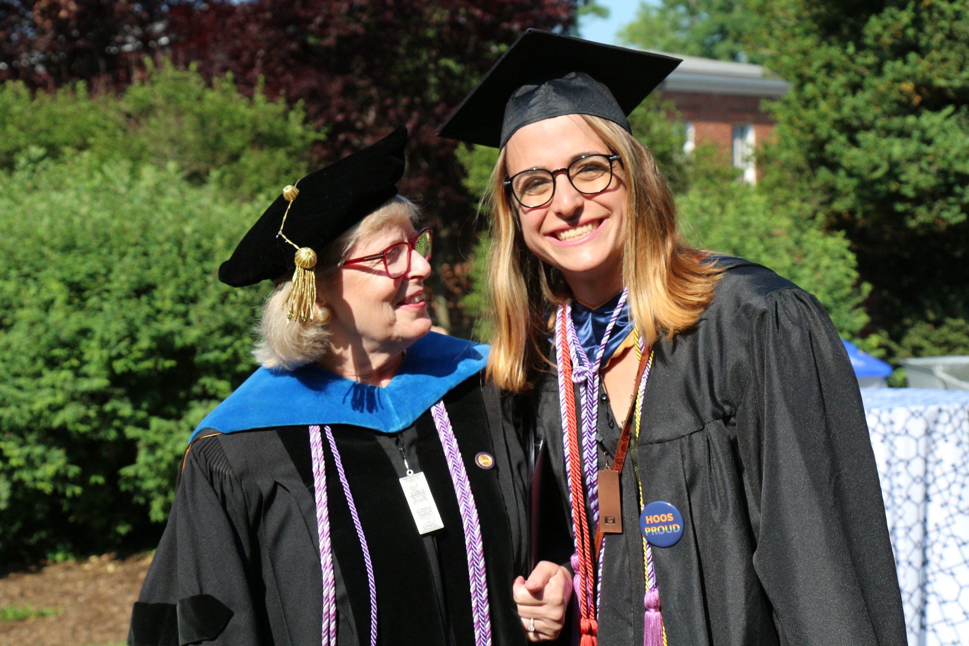 Dallas Ducar, right, with Dorrie Fontaine, wearing graduation attire pose together for a picture