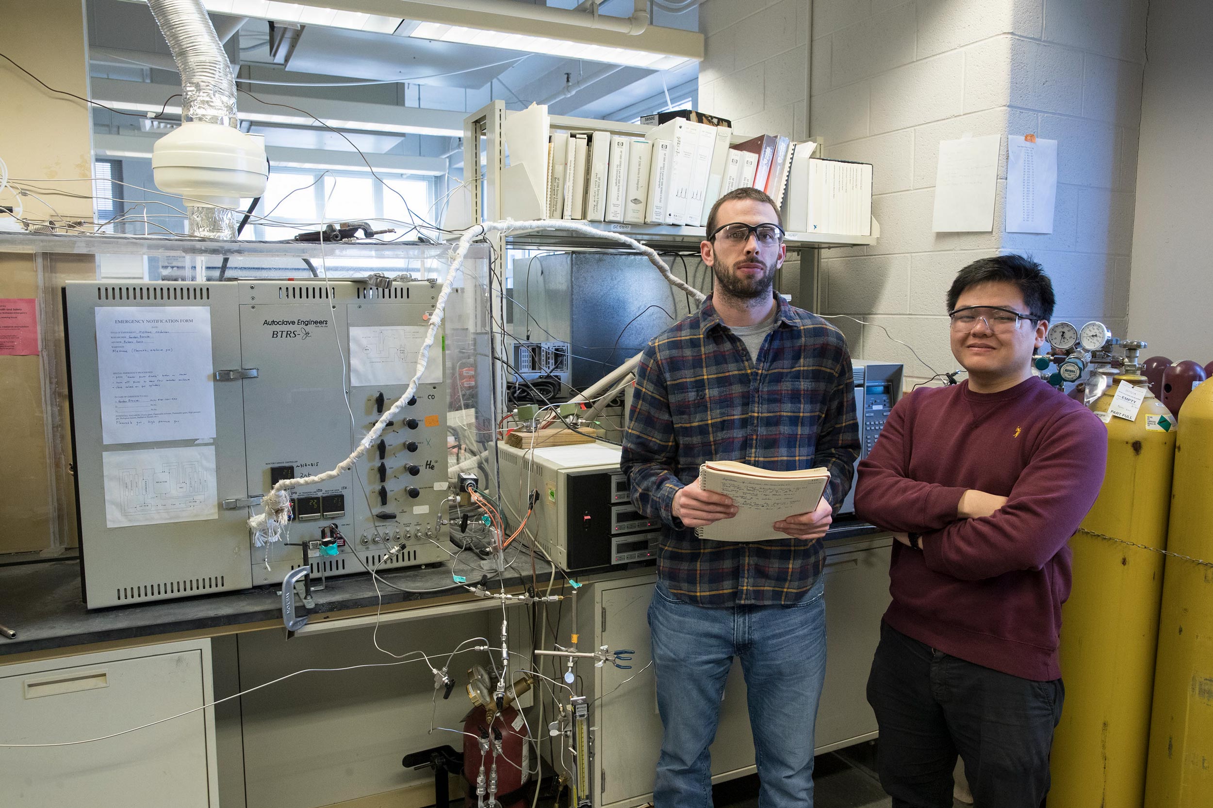 Gordon Brezicki, left, and Jonathan Zheng stand for a picture in a lab