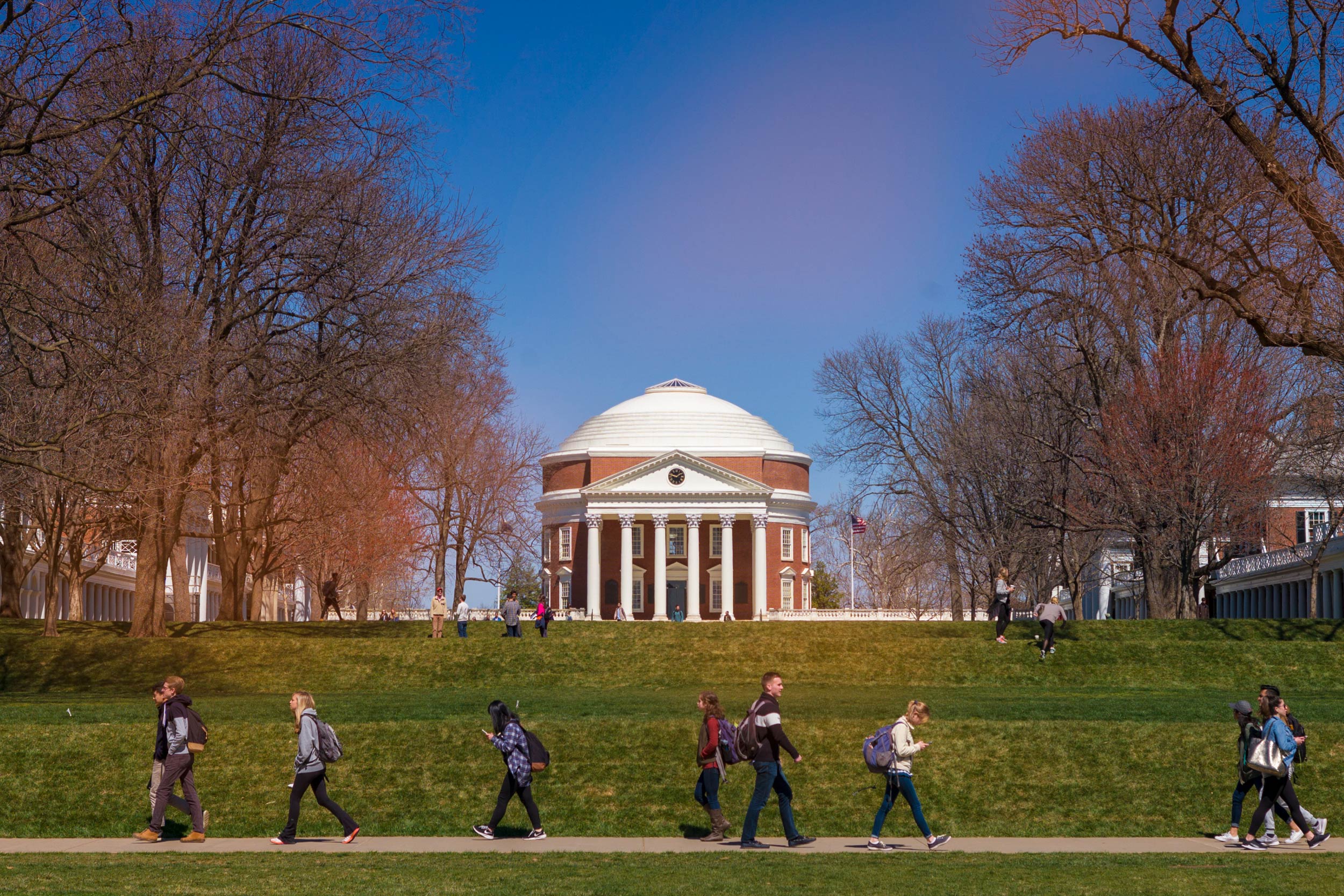 The Rotunda from the Lawn with students walking on the sidewalks on the Lawn