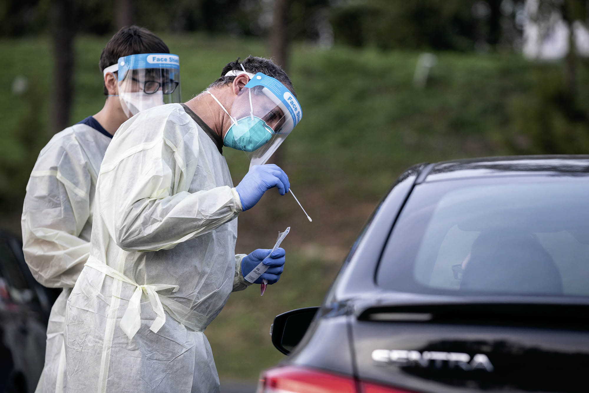 Healthcare professional testing a drive at a drive through clinic