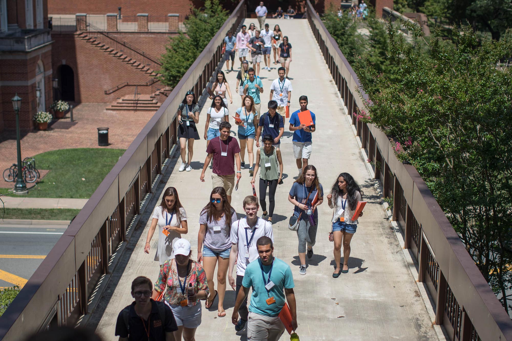 New students walk across bridge as a group