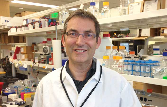 Headshot of a man in a lab