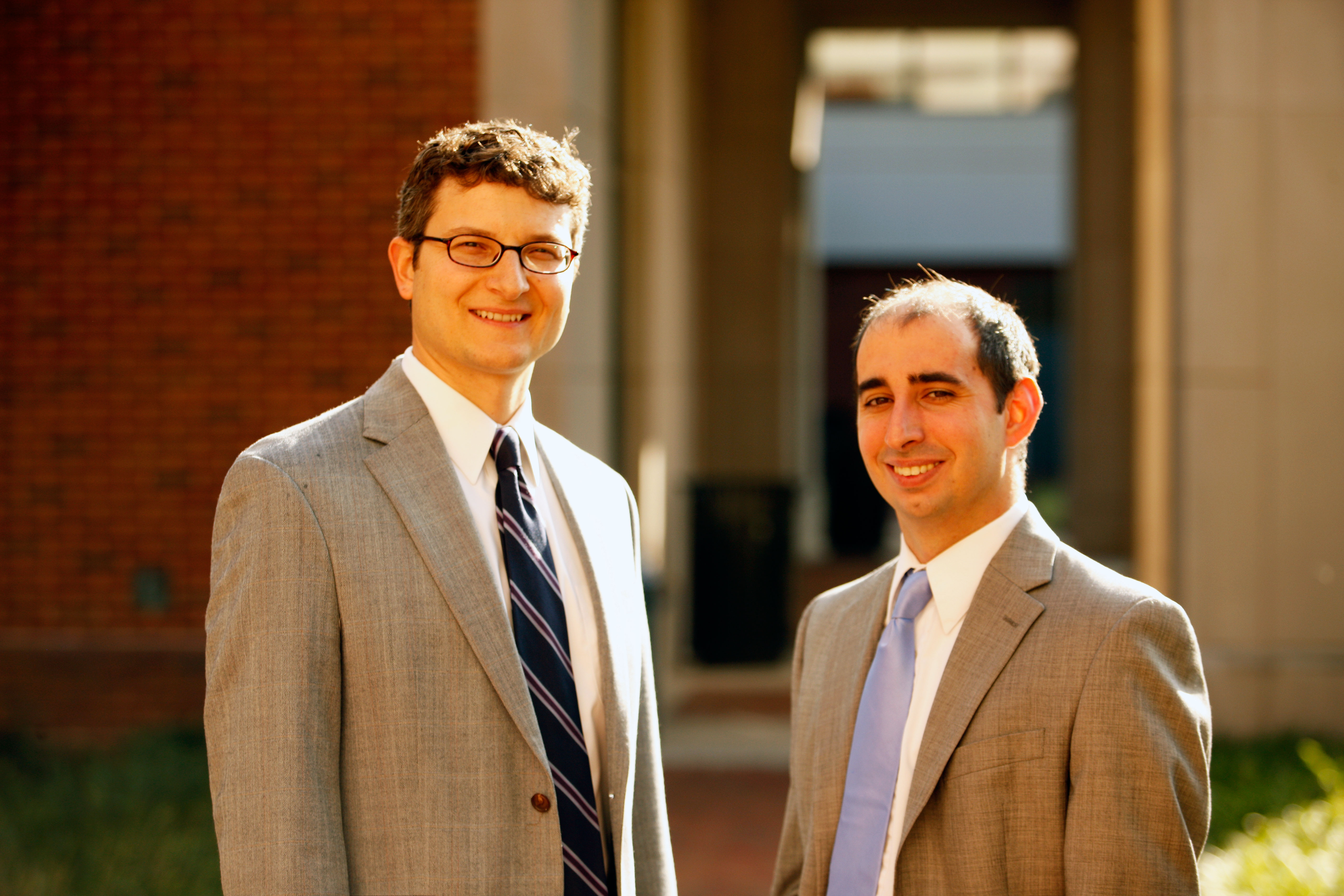 Michael Gilbert and Benjamin Aiken smile at the camera