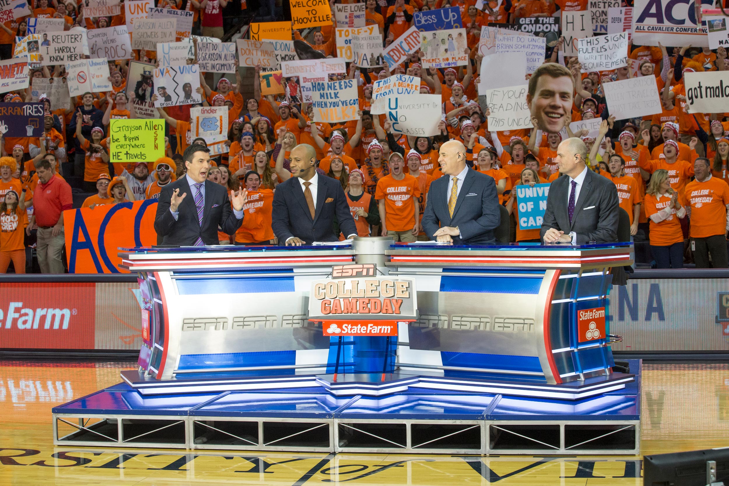 College Game Day setup on basketball court with UVA Fans behind them