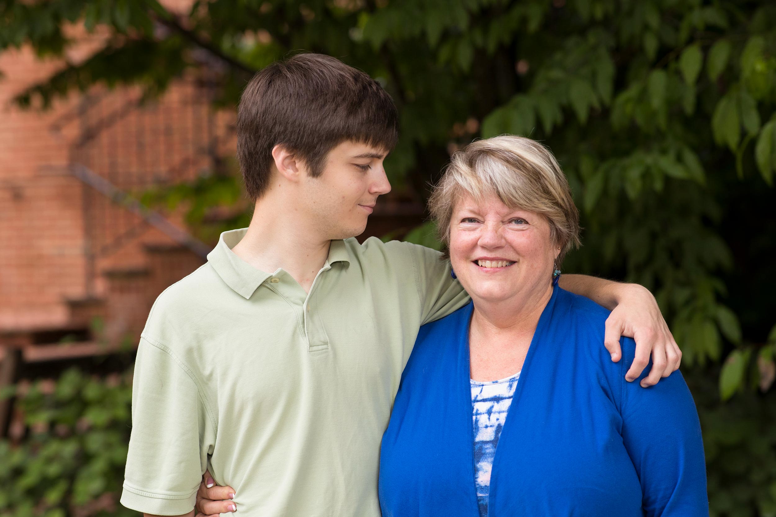 Fay Painter and her son Adam stand together for a picture