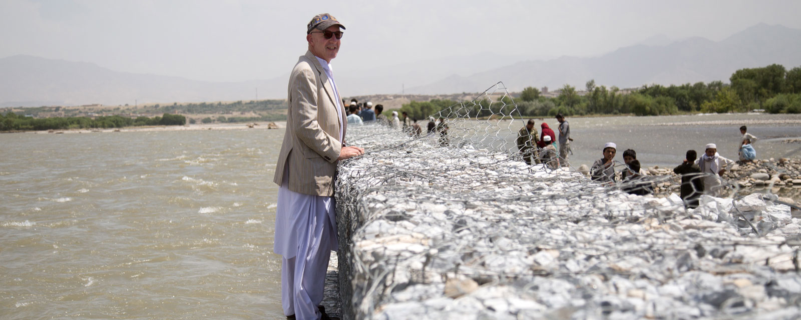 Richard Danziger, surveys a floodwall at an Afghanistan village