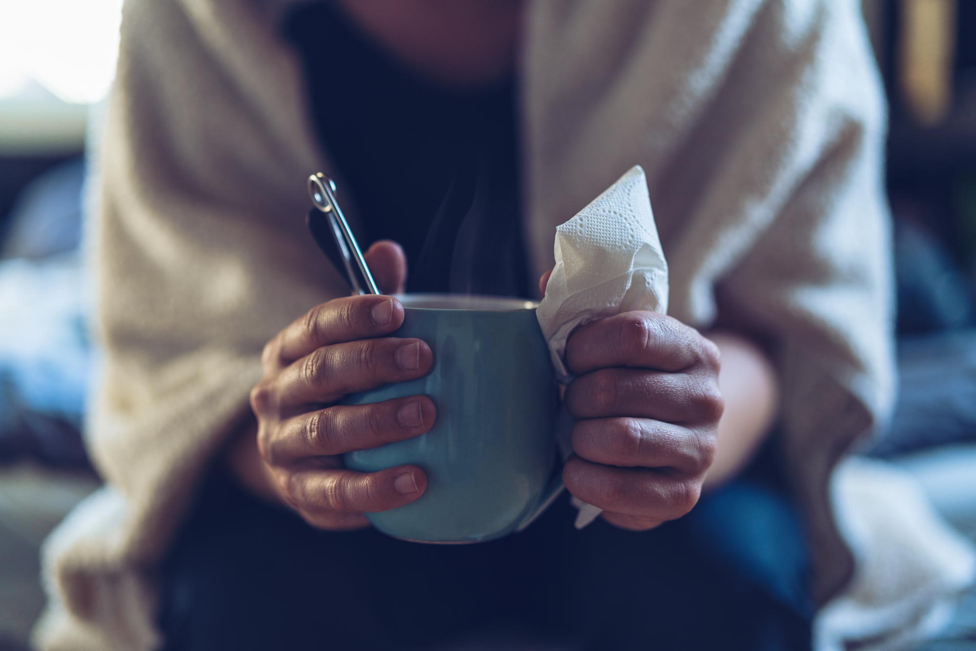 person holding a hot mug