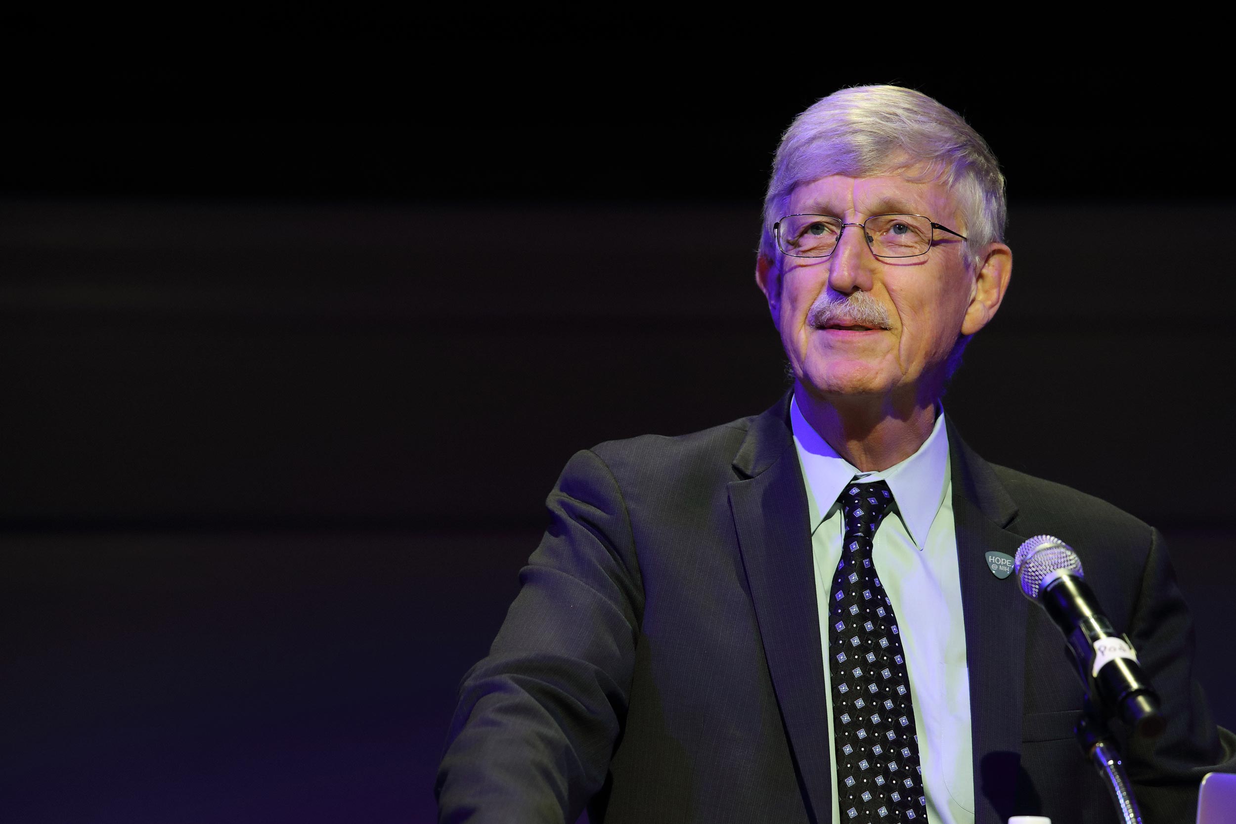 Dr. Francis S. Collins stands at a podium