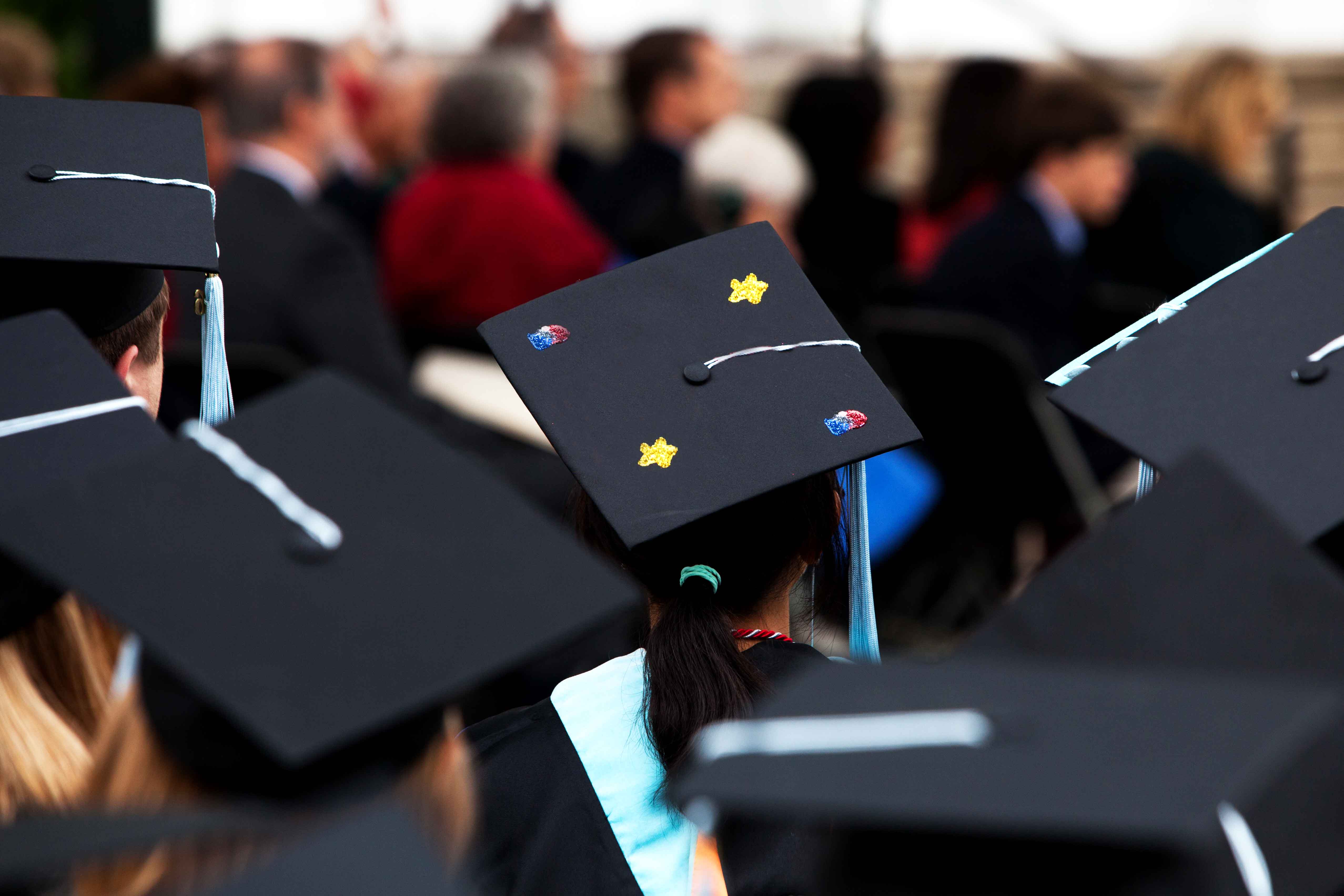 Black Graduation caps on students