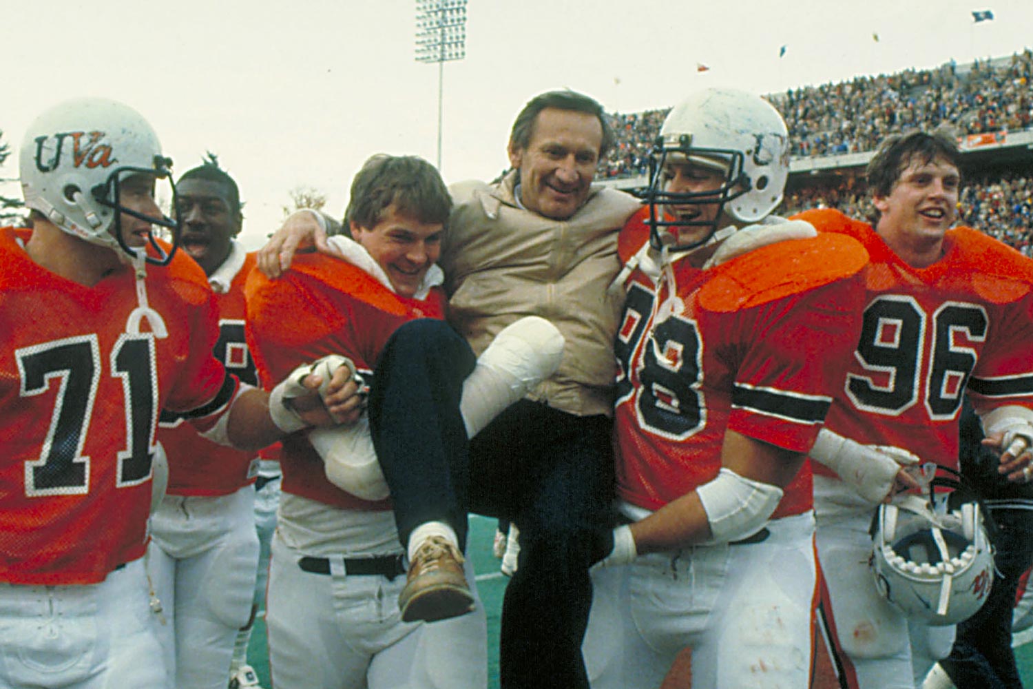 George Welsh being carried by the UVA football team after a game