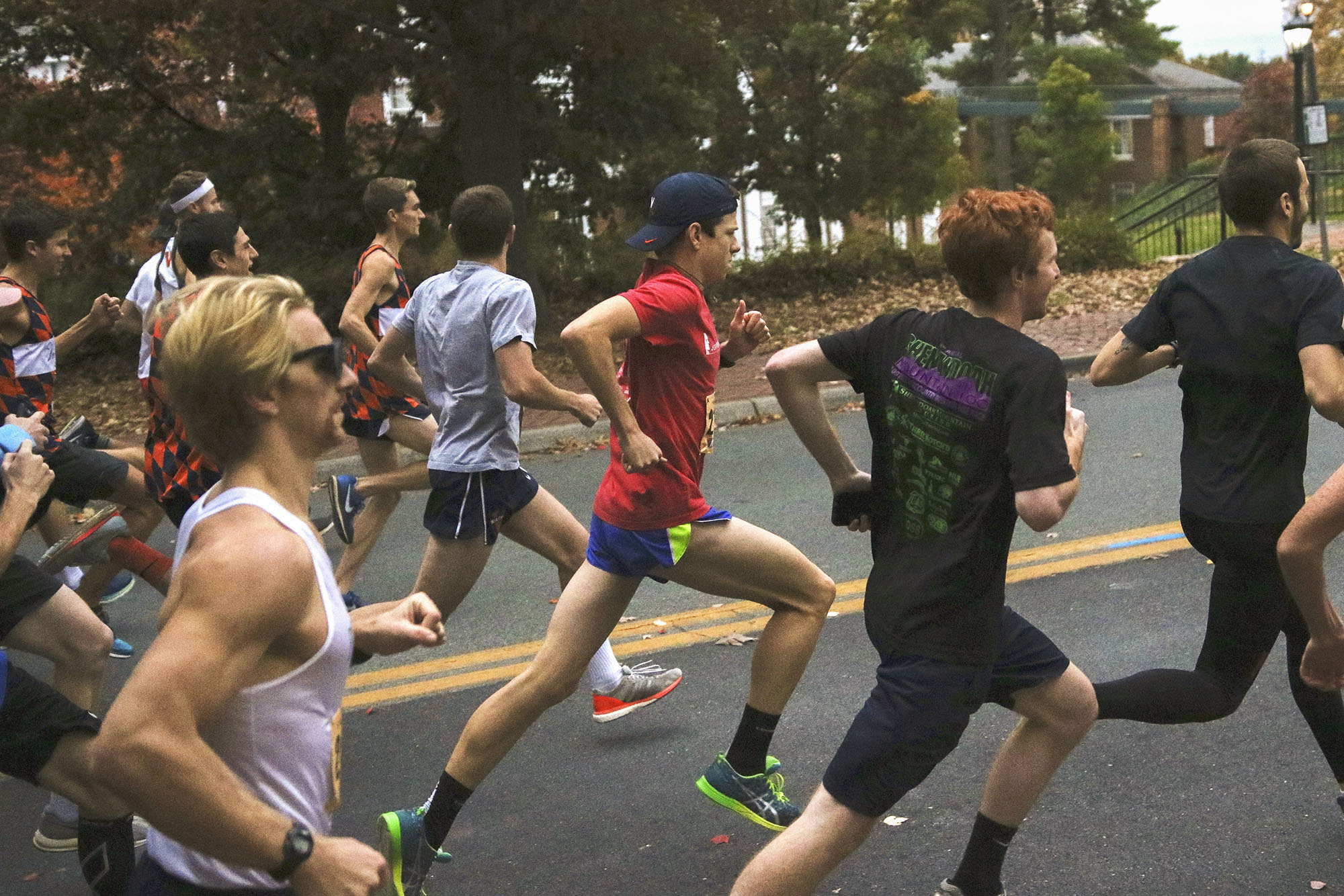 Students running the 4th year 5K on a road