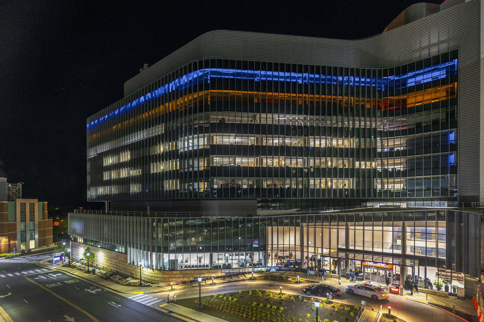 UVA ER's top two floors lit in blue and gold 