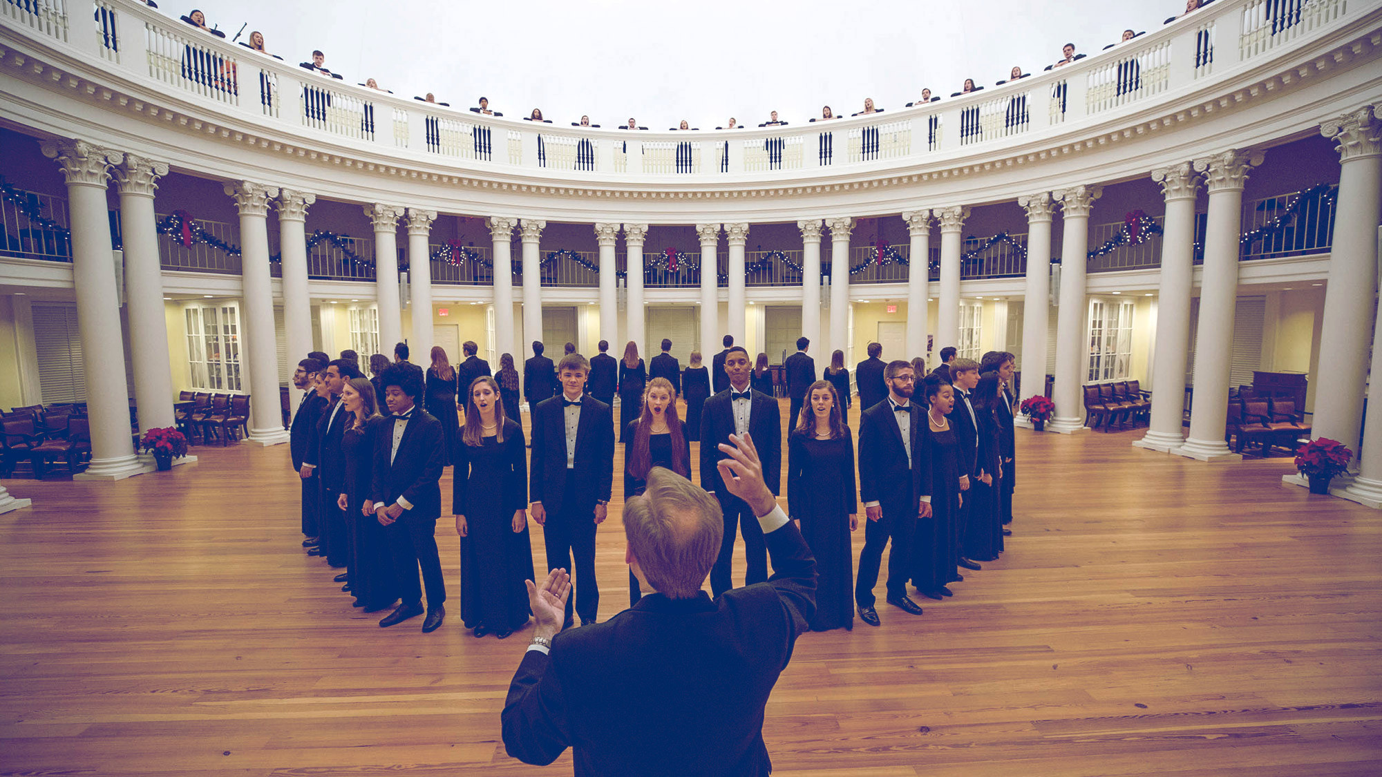 UVA choir singing in the Rotunda for a Holiday performance in the Dome Rome for a video