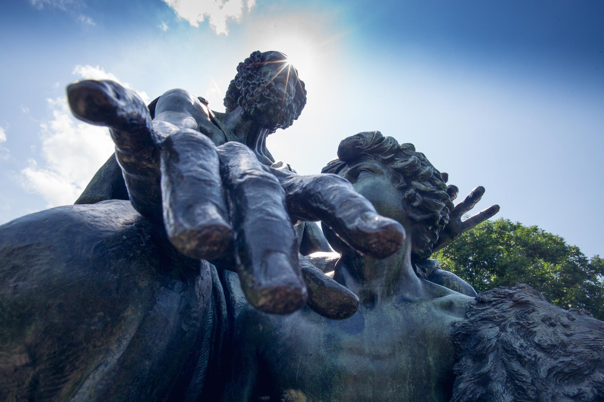 Up close view of homers hand on his statue on grounds