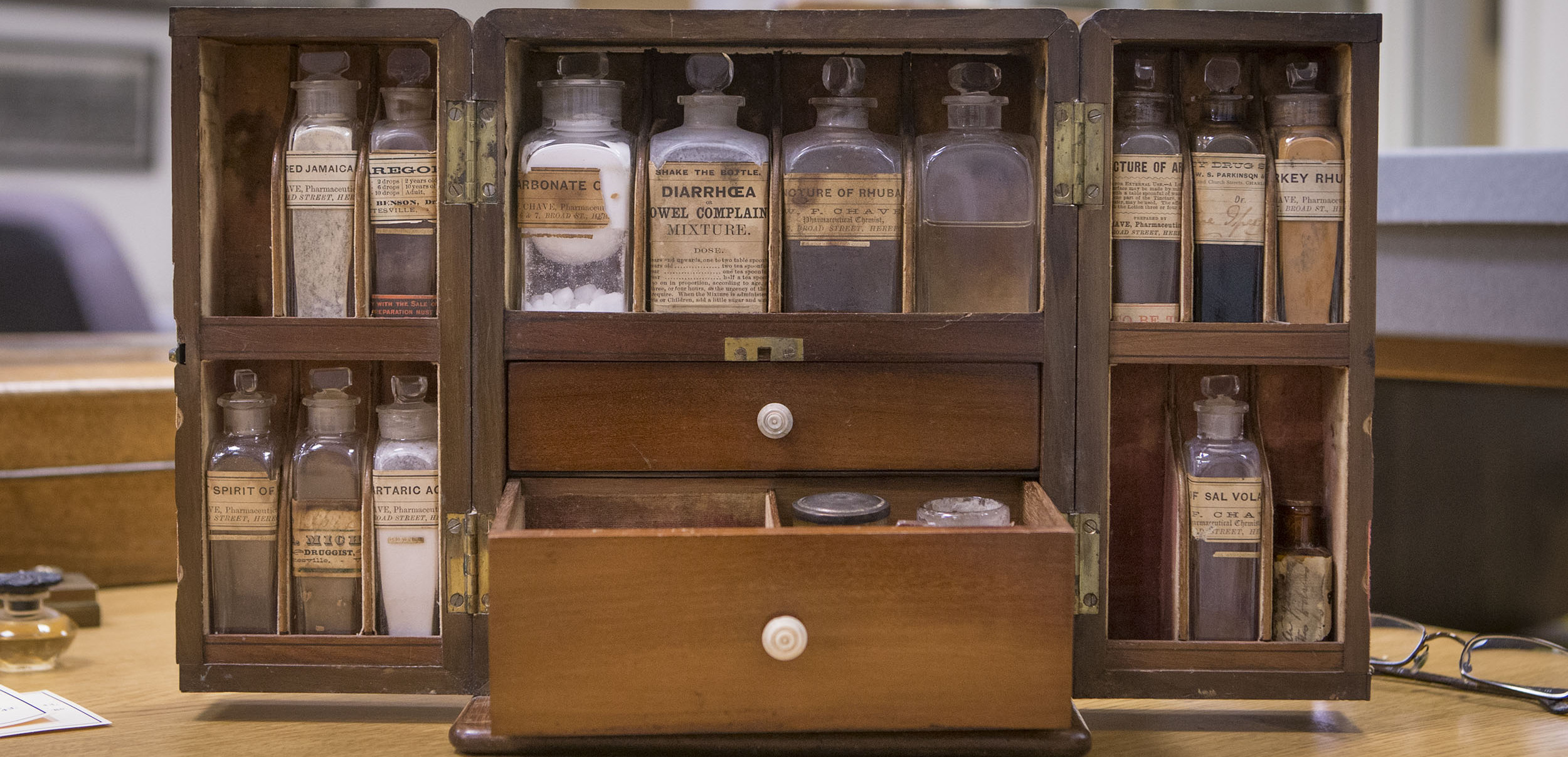 Old medicine cabinet with old bottles of medicine 