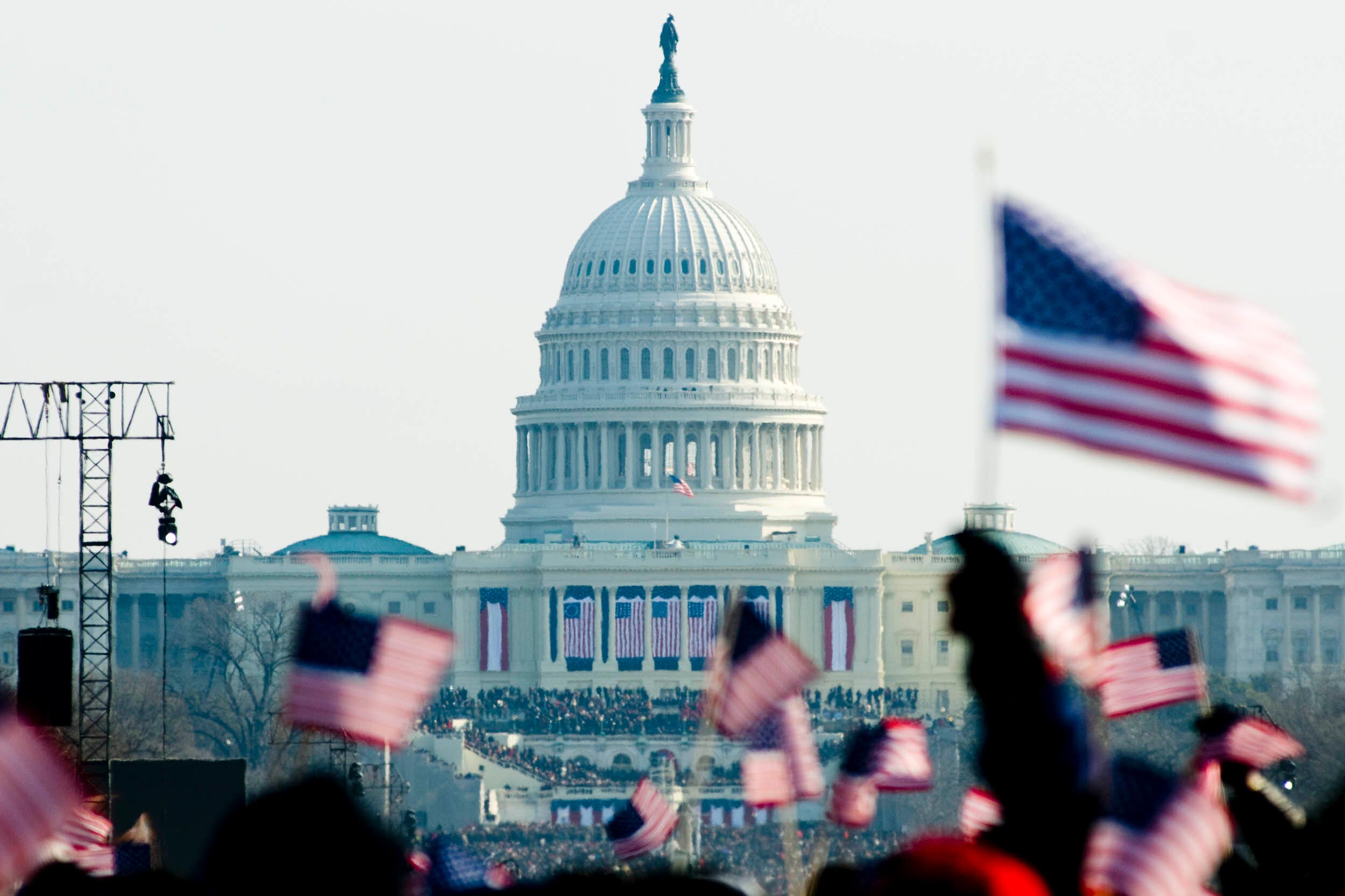 The capital grounds filled with people and American Flags during an Inauguration 