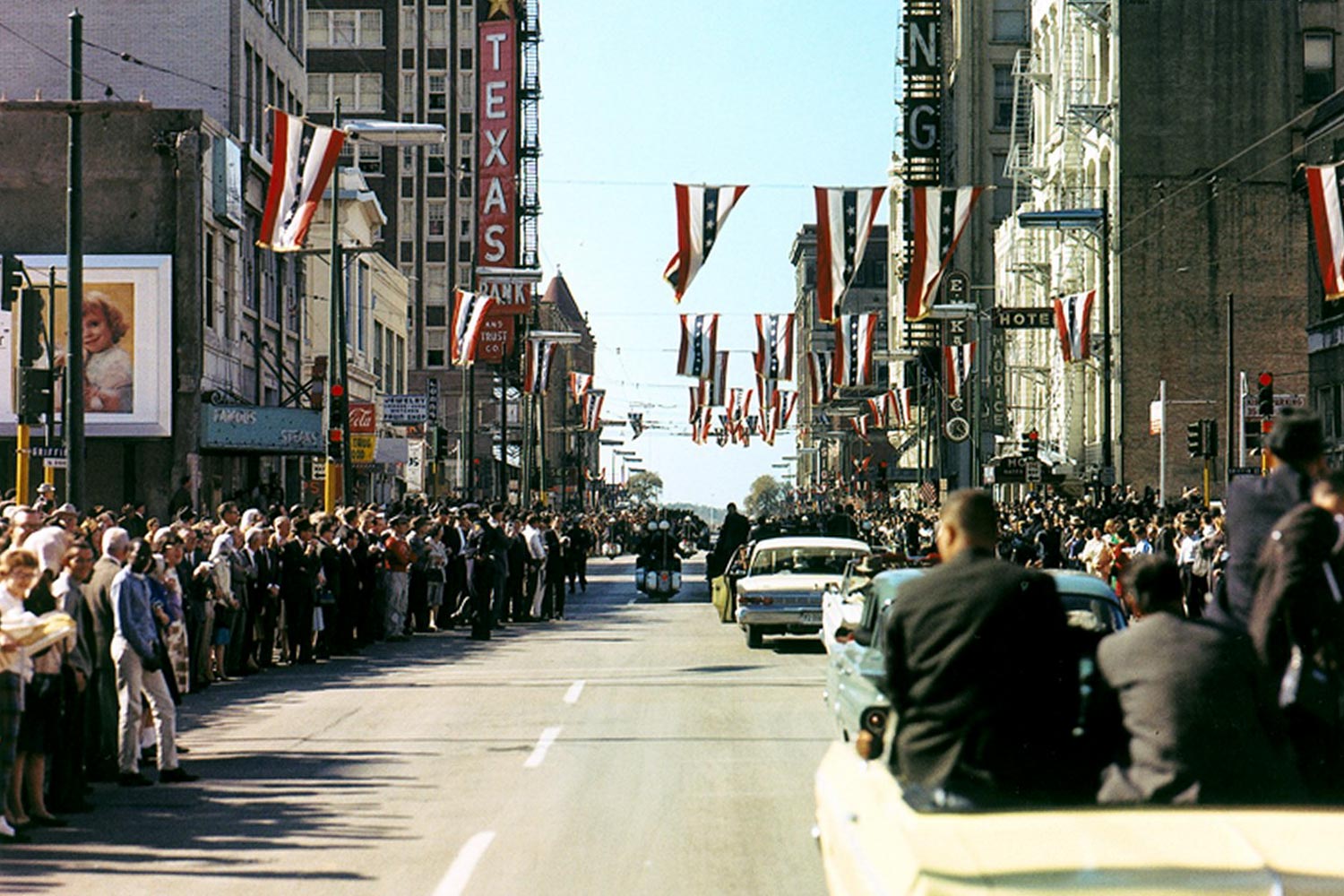 Streets lined with people waiting to get a glimpse of John F. Kennedy