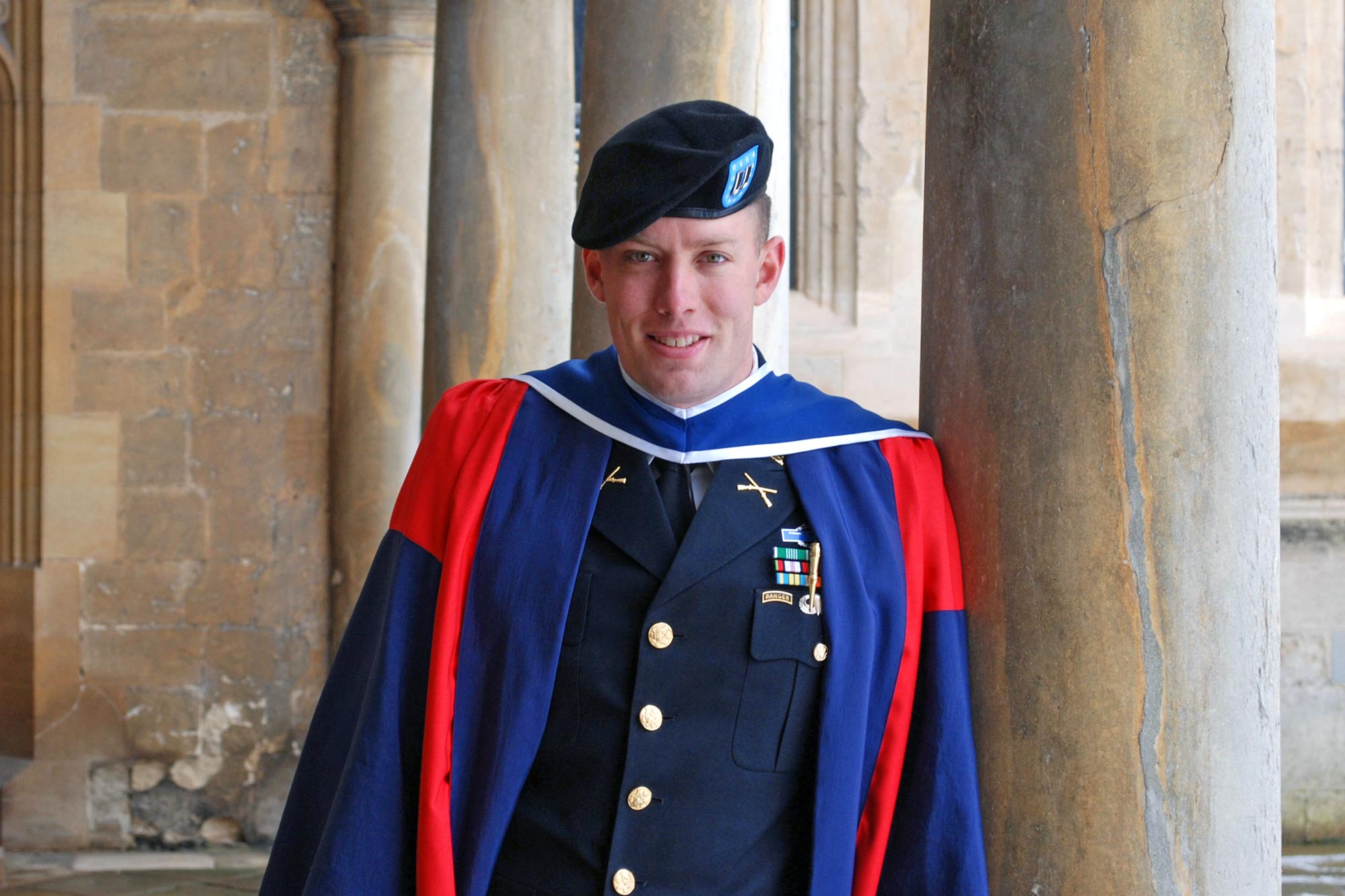 Joe Riley dressed in his military uniform next to a column