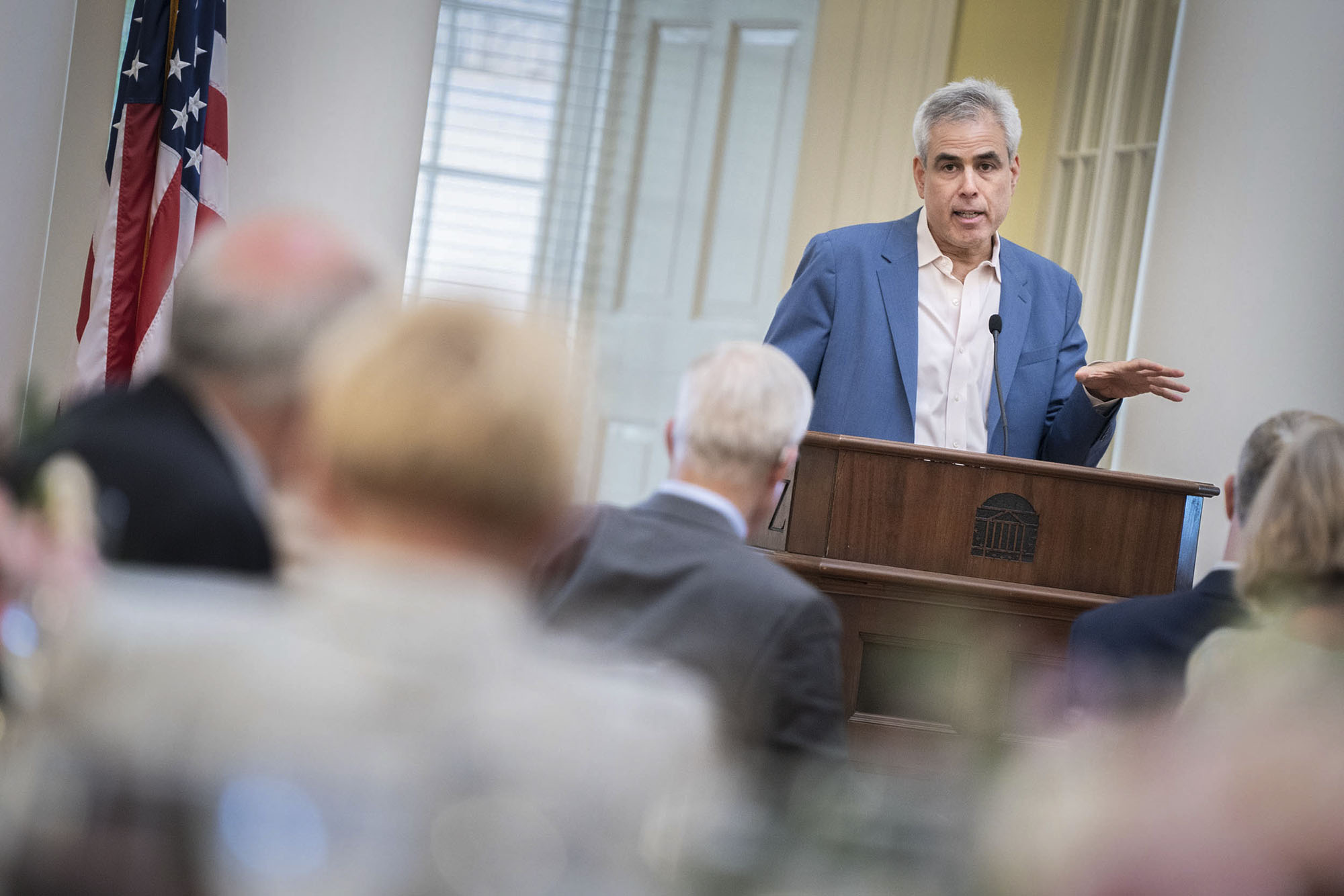 Jonathan Haidt stands at a podium giving a speech