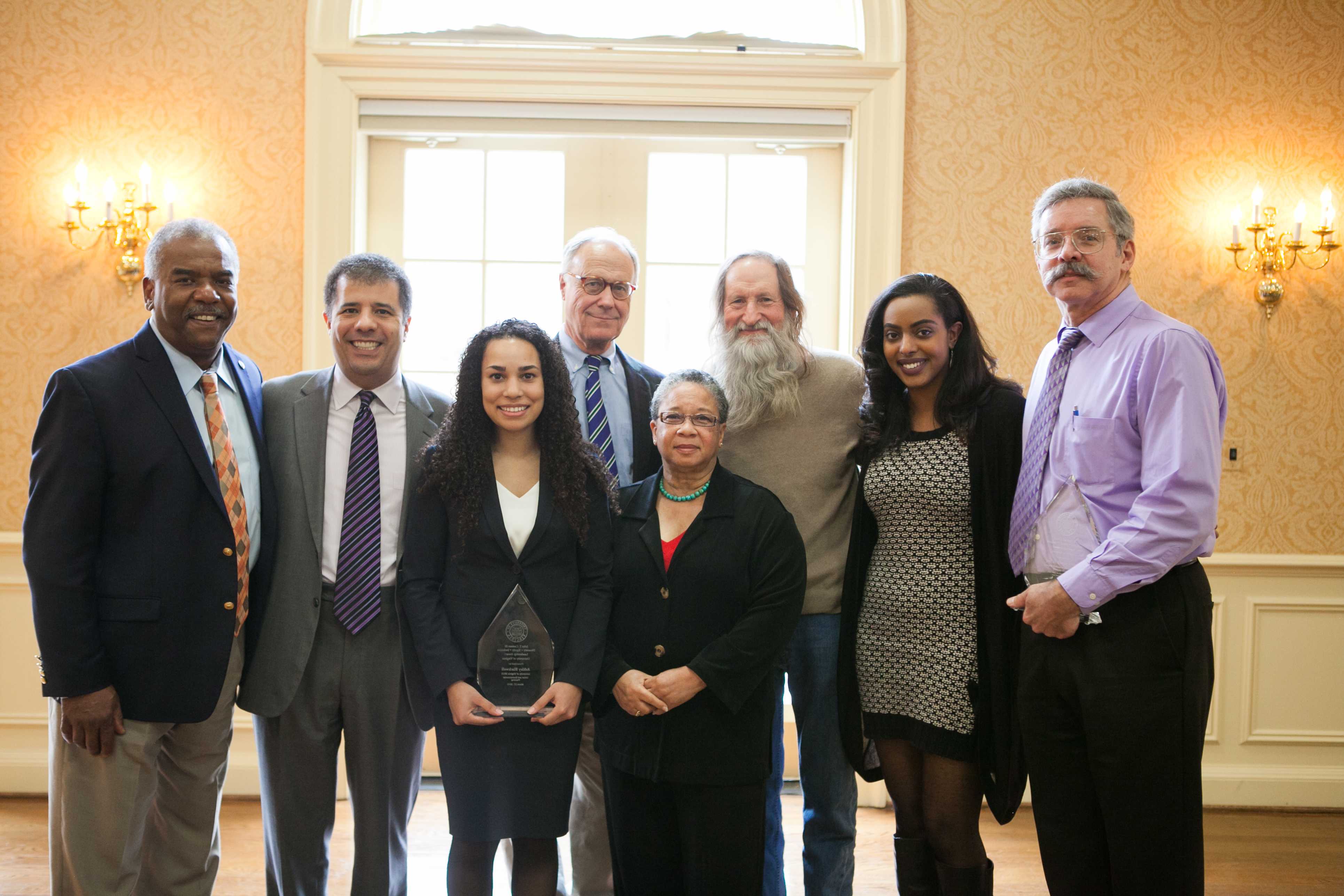 group photo from left, Dr. Marcus L. Martin, Kim Forde-Mazrui, 2015 co-winner Ashley Blackwell, former President John T. Casteen III, Angela Davis, Bob Covert, Hajar Ahmed and  Joel Hockensmith