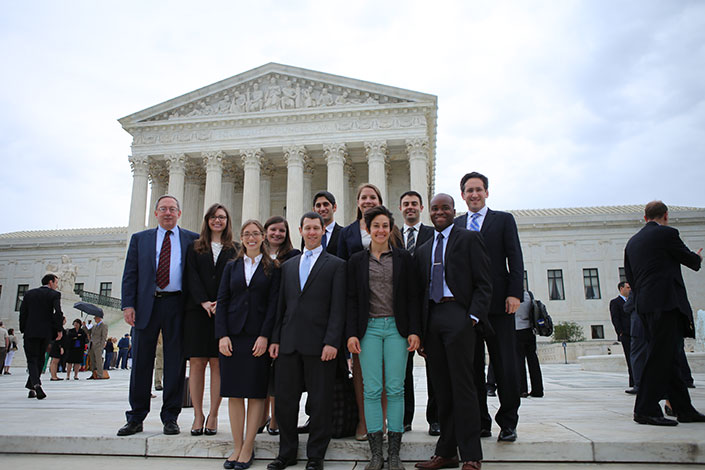 Douglas Laycock, top left, stands with students outside of the Supreme Court house