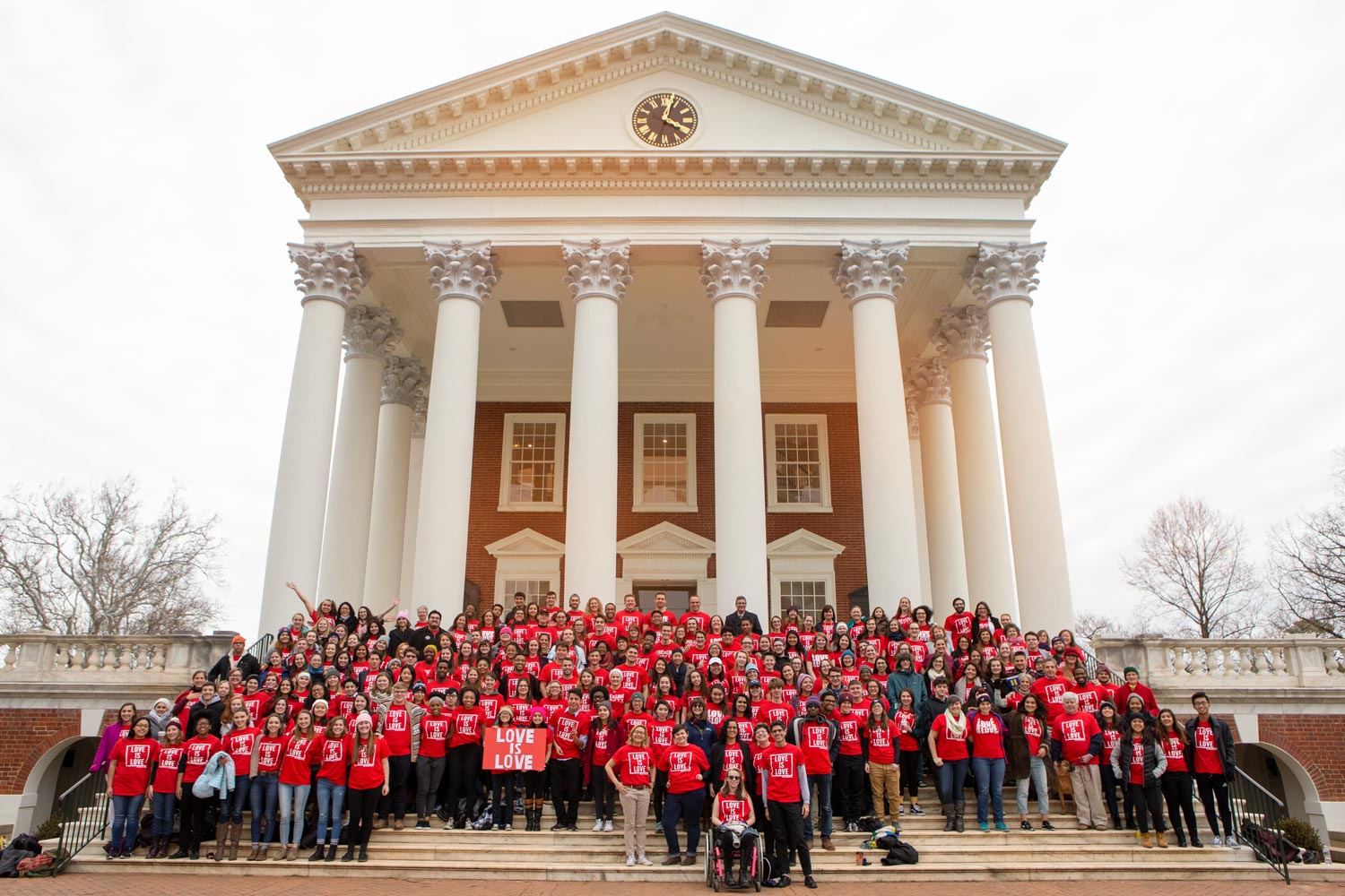 People in Red shirts standing on the Rotunda steps