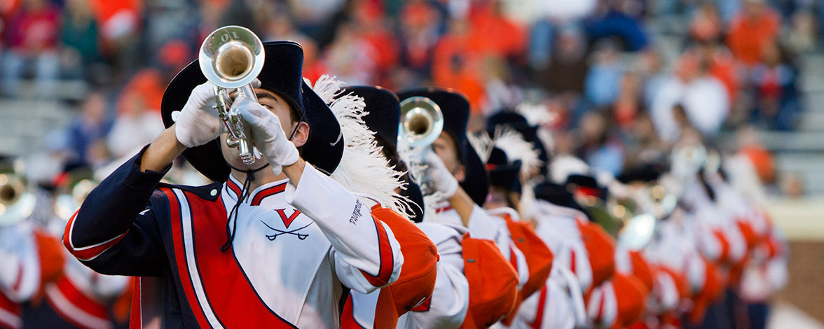 Cavalier Marching Band playing their instruments during a football game