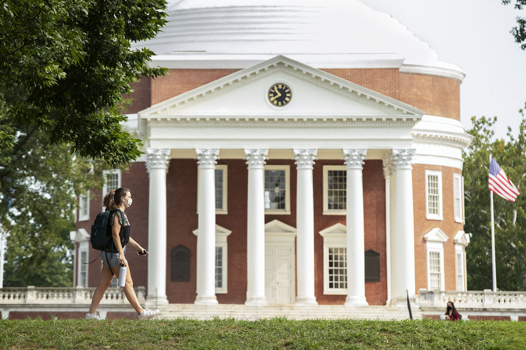 Student walking in front of the Rotunda