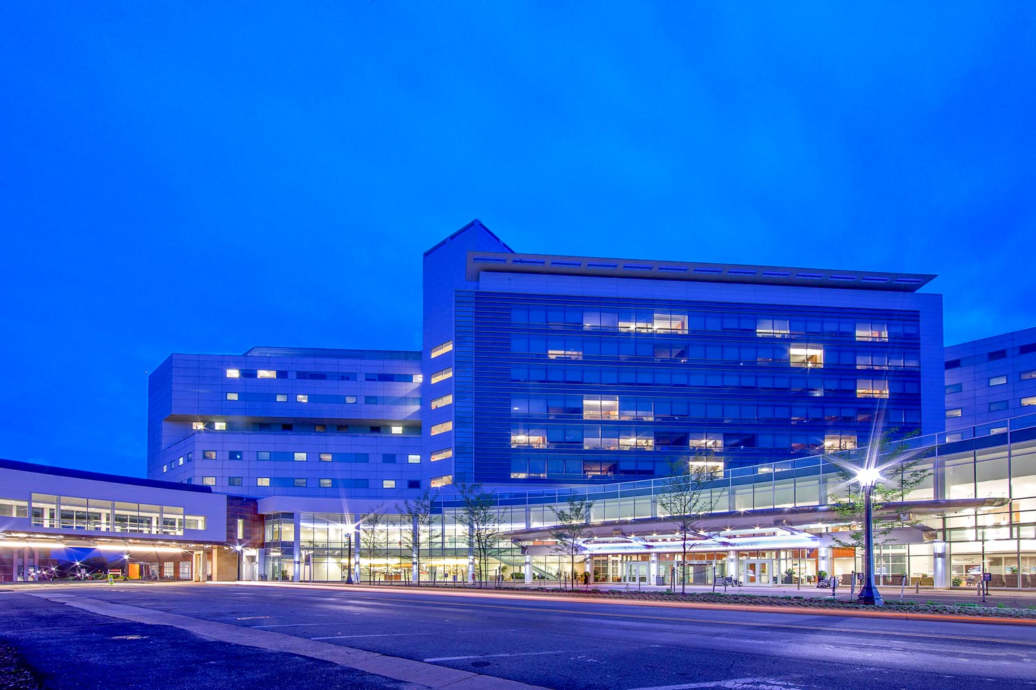 UVA hospital entrance at dusk with lights on
