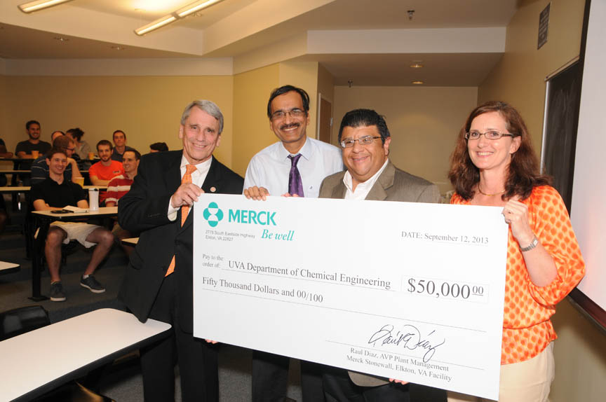 Group photo with them holding a check from Merck for $50,000. Left to right: James Aylor, Abhay Kirpekar, Raul Diaz and Roseanne Ford