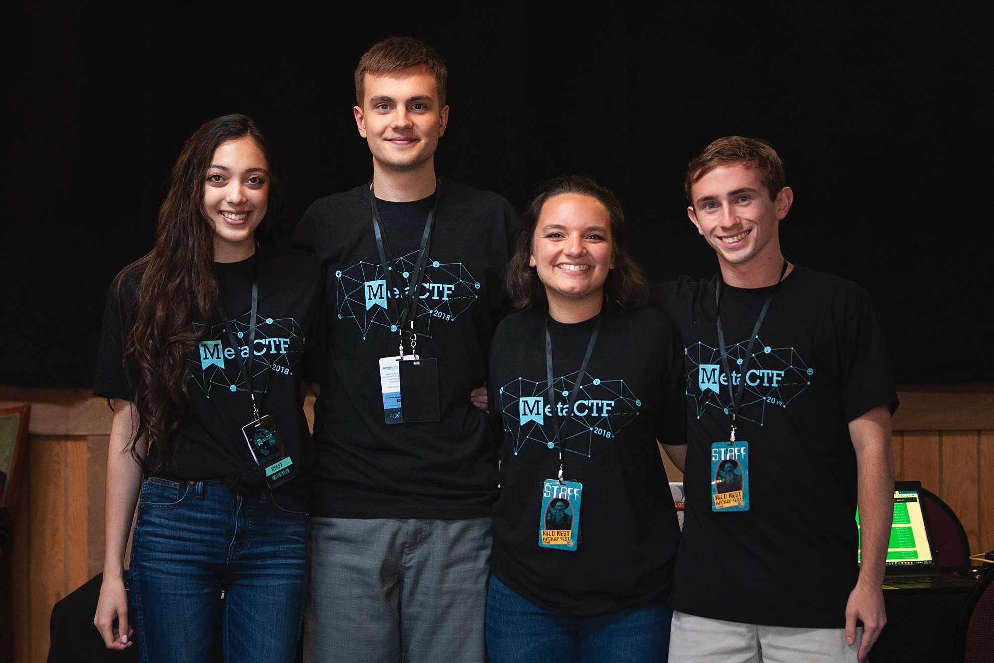 from left, Marina Sanusi, Roman Bohuk, Mariah Kenny and Jake Smith stand together for a photo at MetaCTF