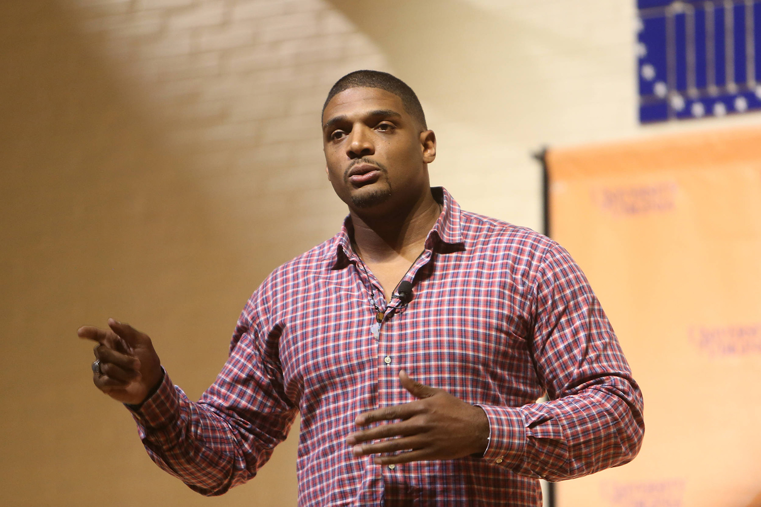 Michael Sam speaking on stage to a crowd