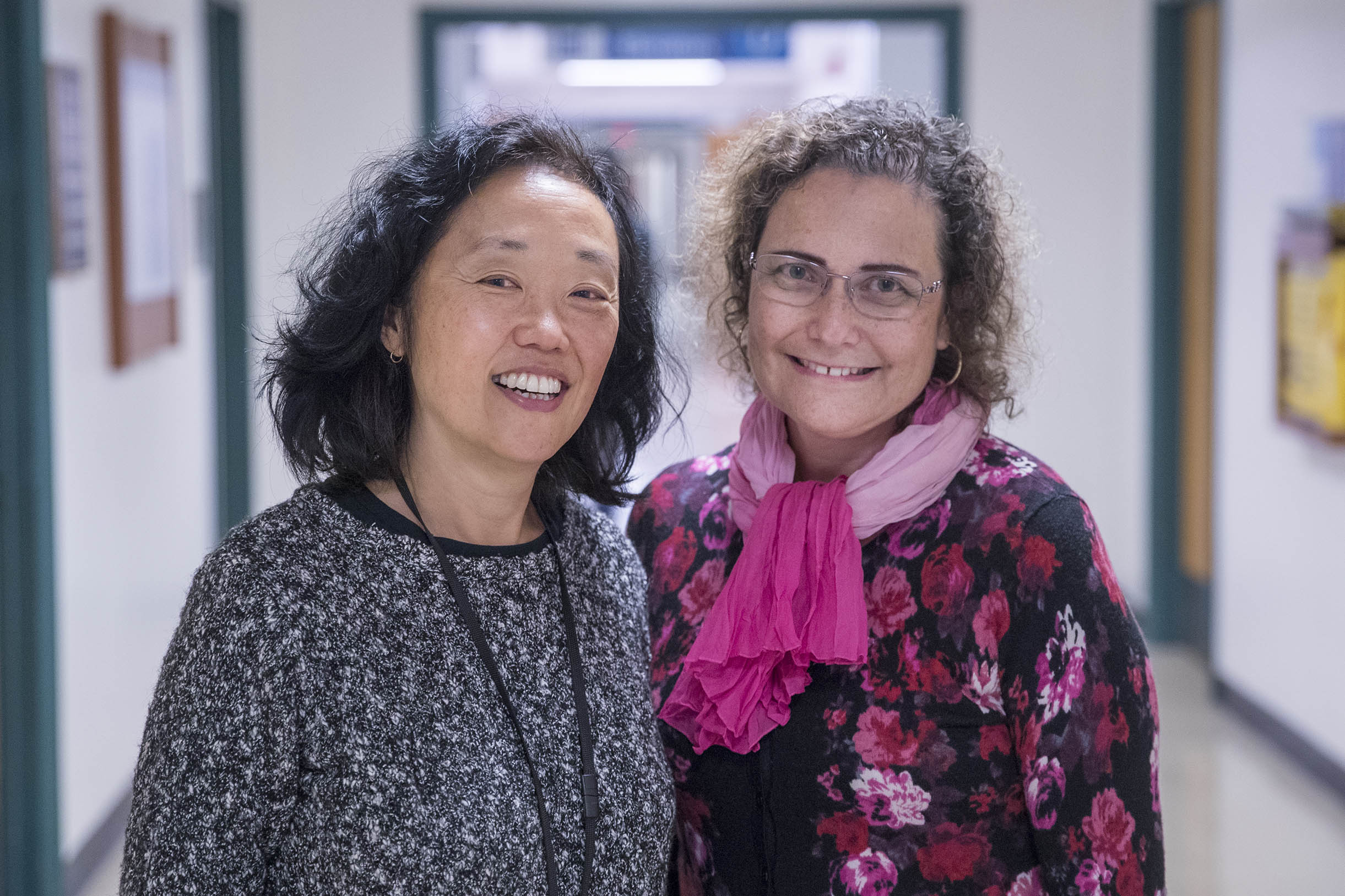 Dr. Rachel Moon, left, and Dr. Fern Hauck stand together looking at the camera