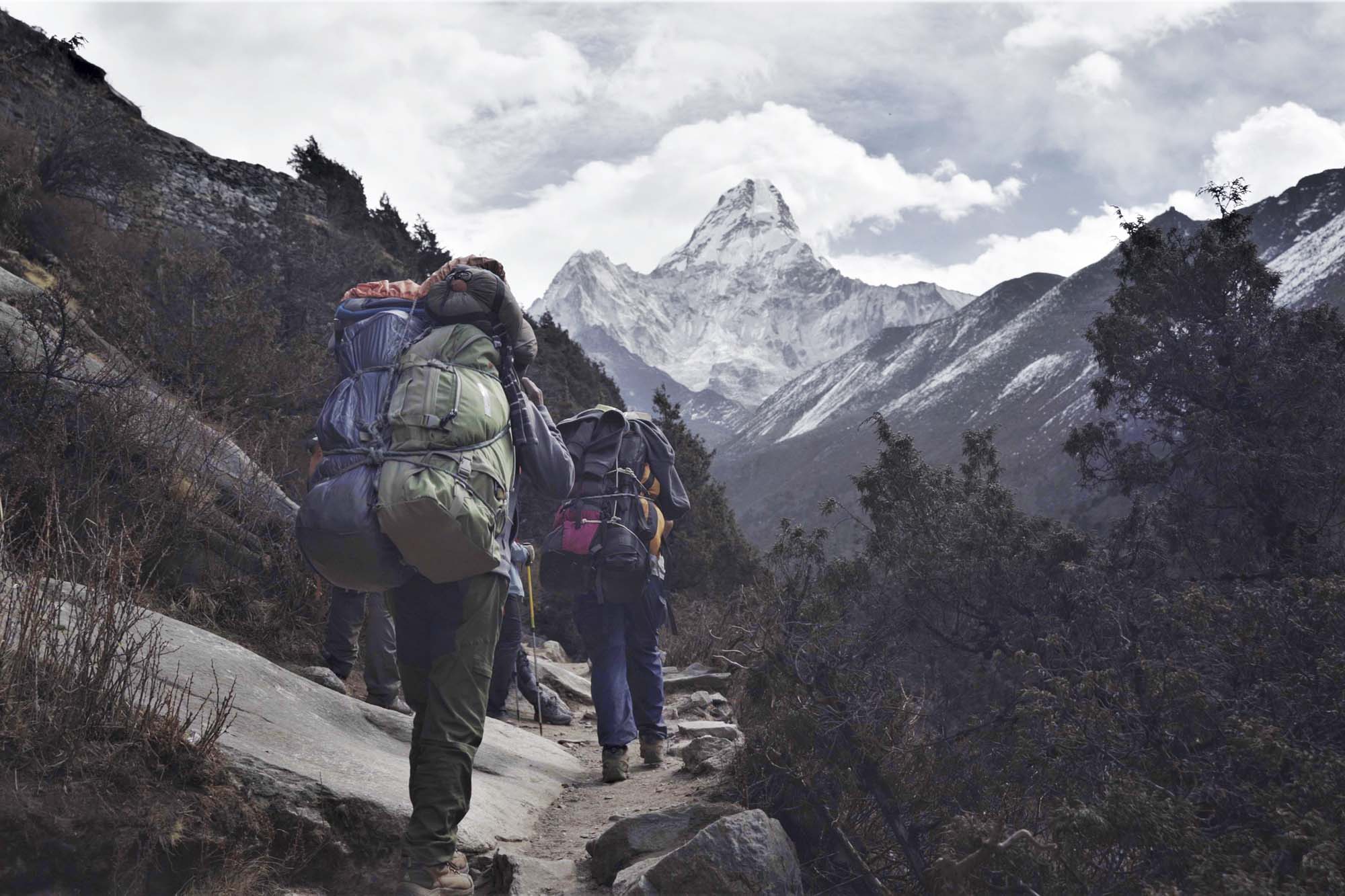 Alumnus Nate Menninger walking on a Himalayan trail
