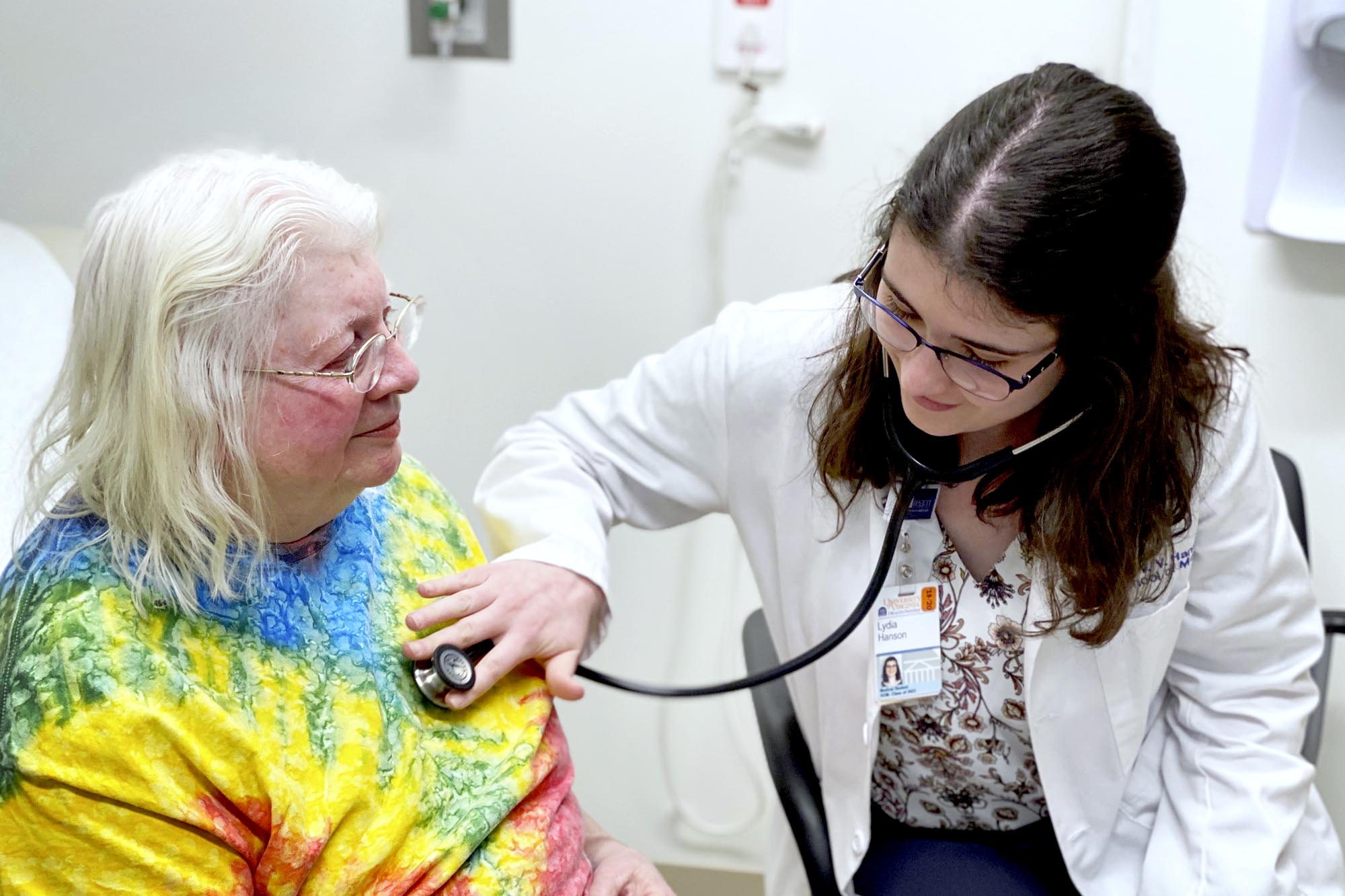 Patricia Otterness, left, has her heart listened to by Lydia Hanson, right 