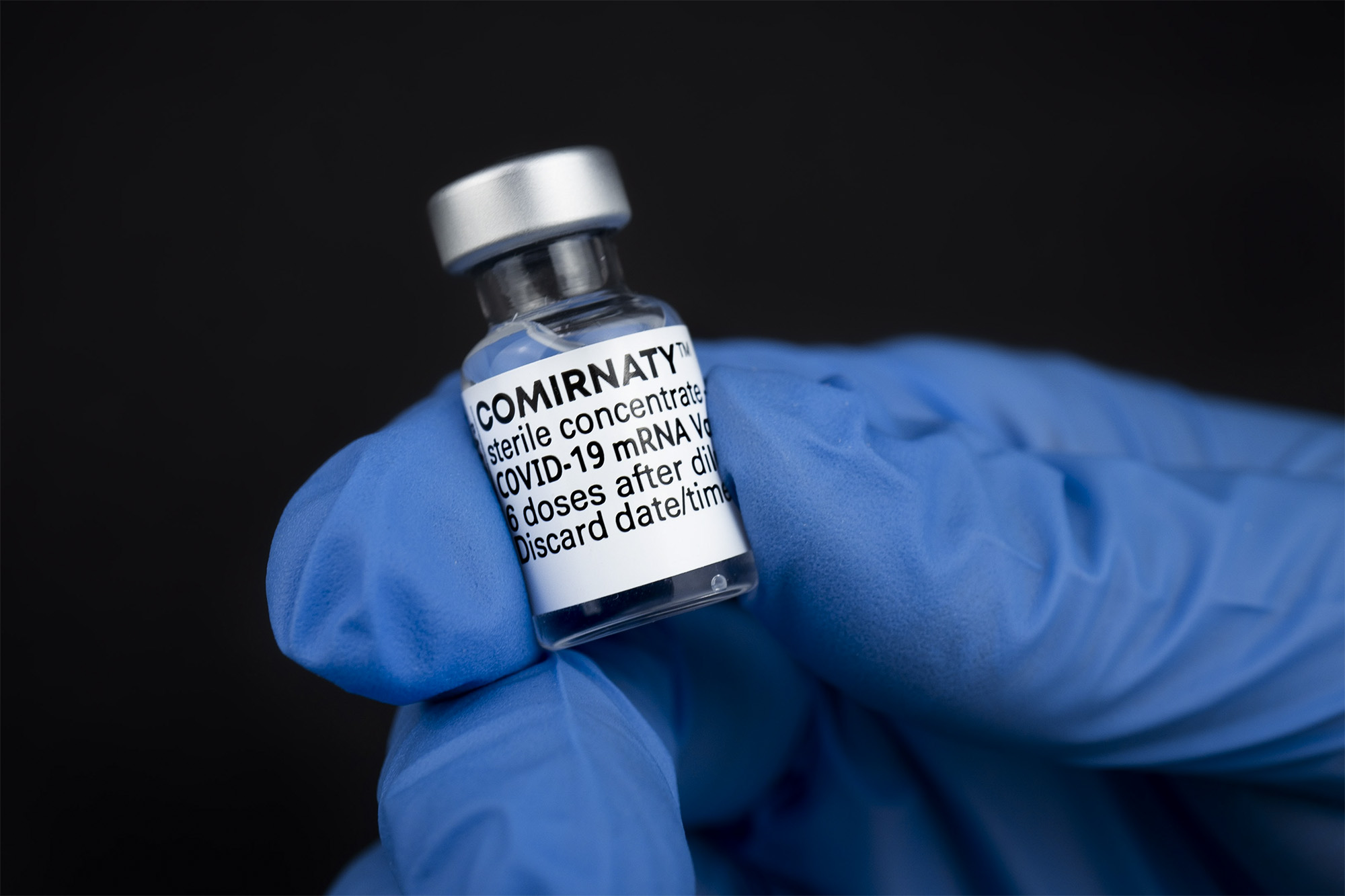 Covid-19 Vaccine vial being held 