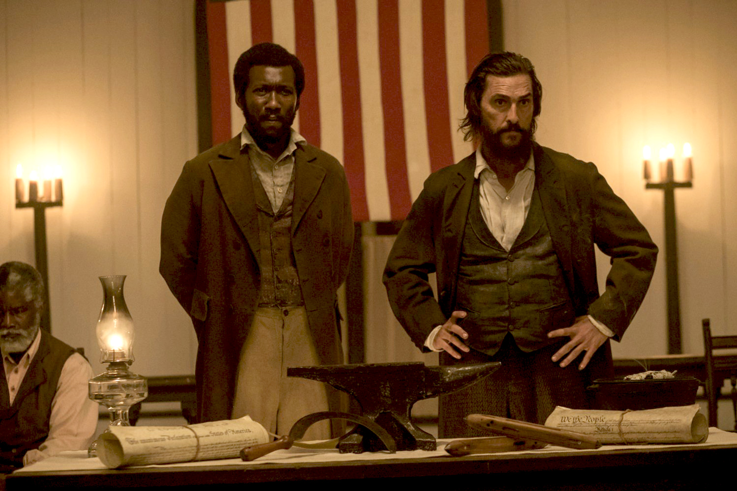 a still from free state jones movie. Matthew McConaughey, right, plays a white Mississippi farmer opposed to slavery and Mahershala Ali plays Moses, a runaway slave