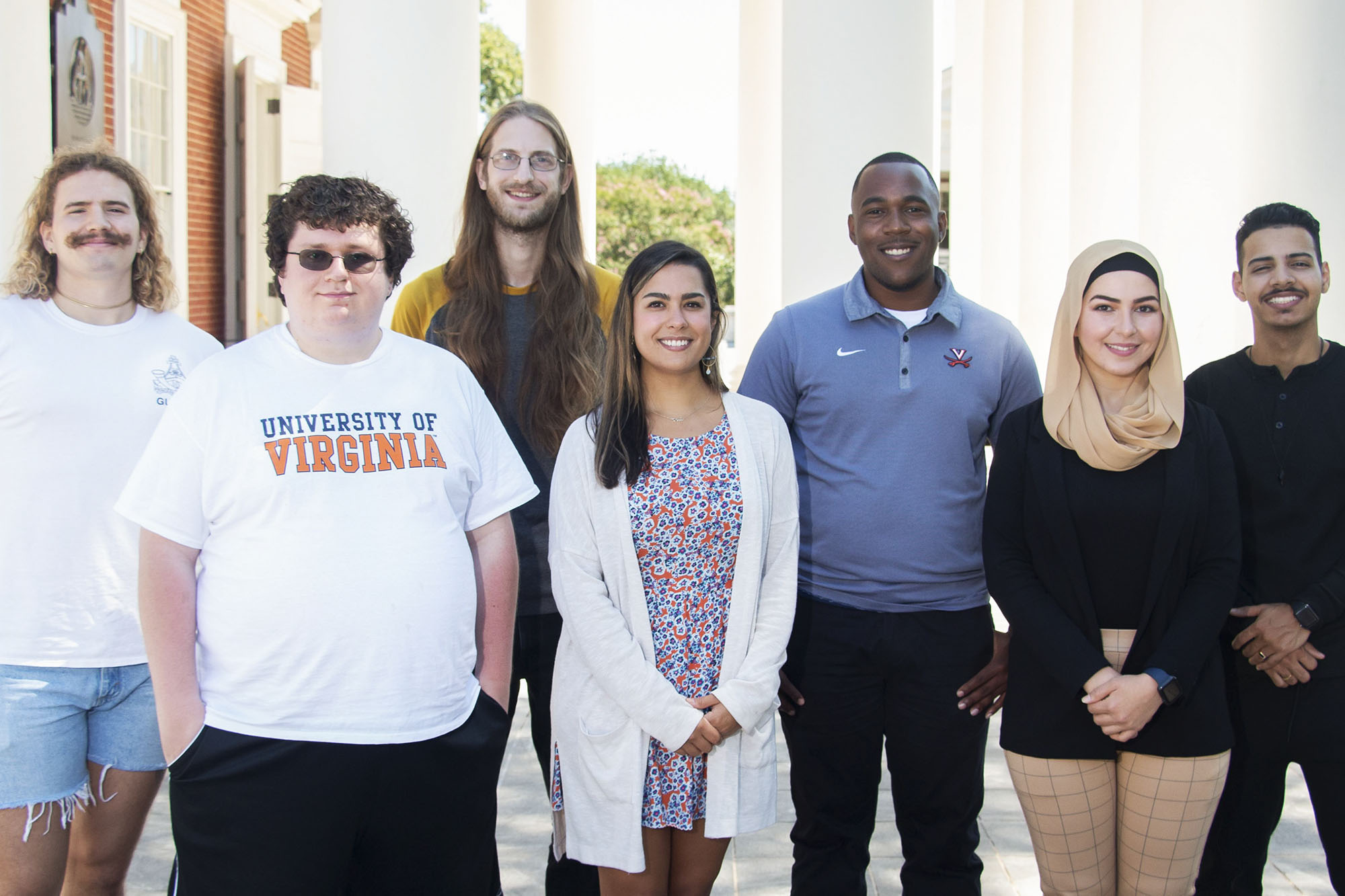 Piedmont Scholars stand in a line, from left, Liam Kidd, Justin Cary, James McIvor, Camille Garcia, Quana Dennis, Sara Abdullah and Christian Garcia Rivera