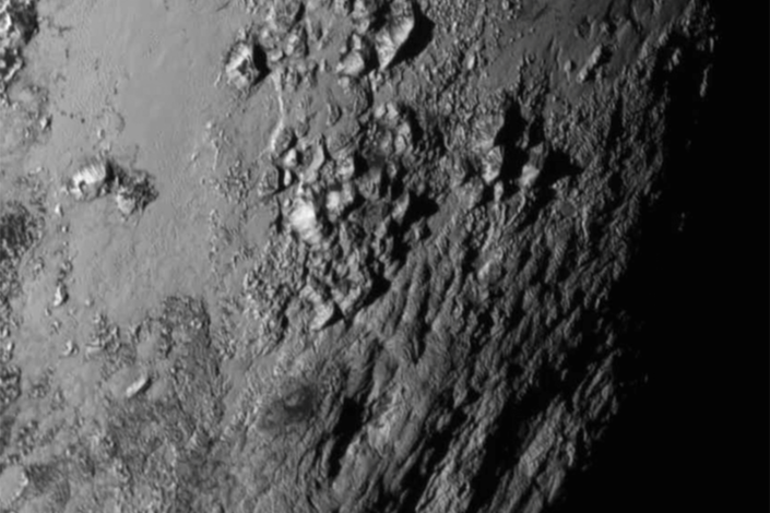 New close-up images of a region near Pluto's equator.  Black and white image