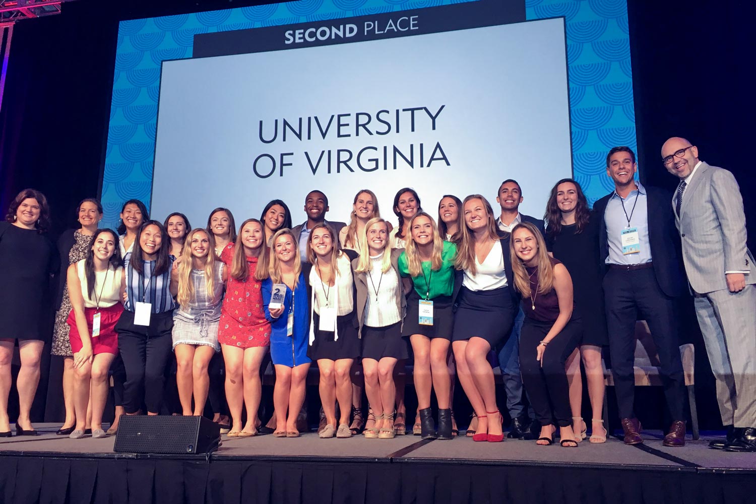 Students in a “Promotions” class celebrate on stage in Chicago after winning second place