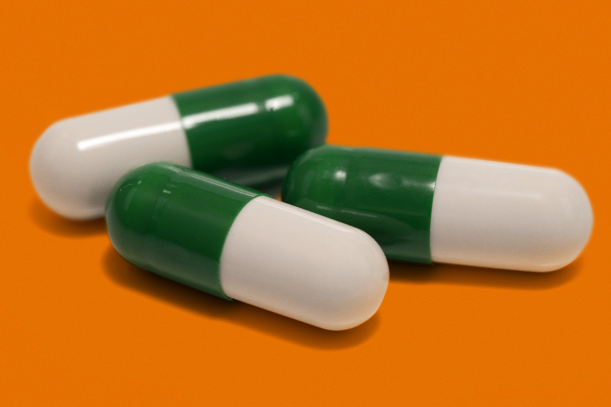 Prozac pill: oblong pill that is half green and half white