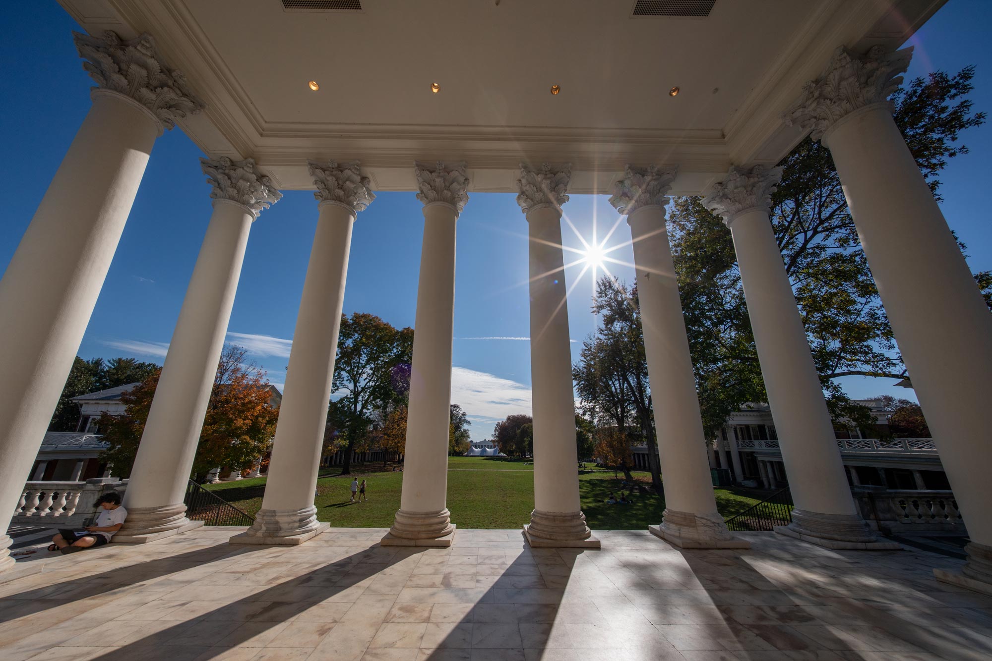 Looking through the columns of the Rotunda out towards the Lawn as the sun sits high in the sky
