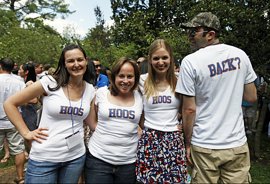 Group of Alumni pose with UVA shirts