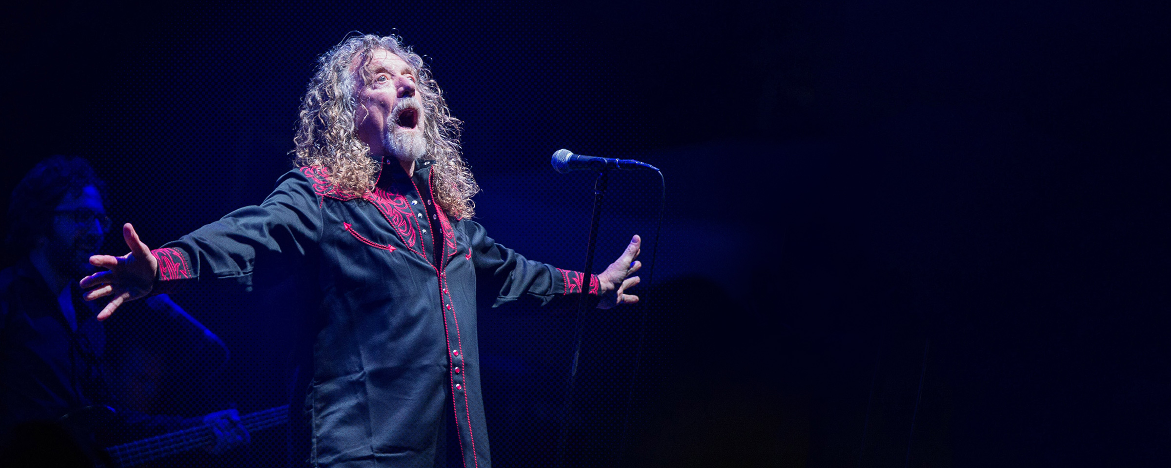 Robert Plant singing at a microphone