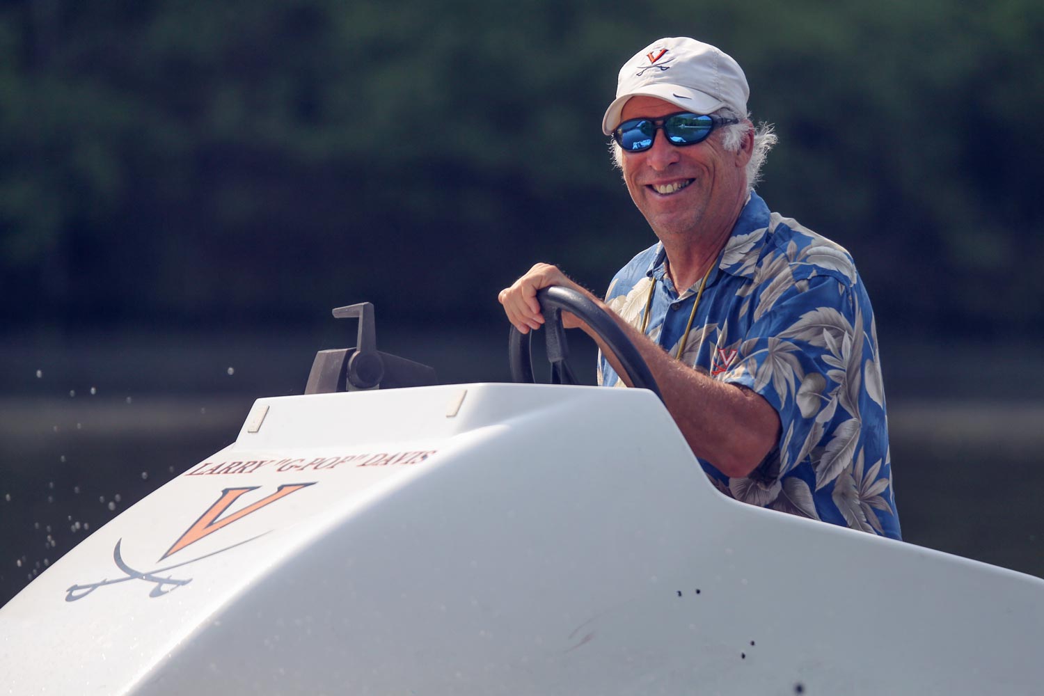 Roger Payne driving a boat