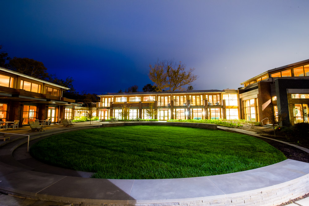 Jefferson Fellows Center entrance lit up at dusk