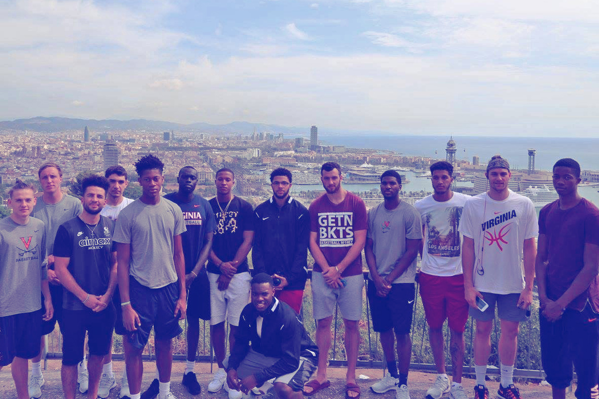 Members of the Cavalier basketball team stand for a group photo overlooking Spain
