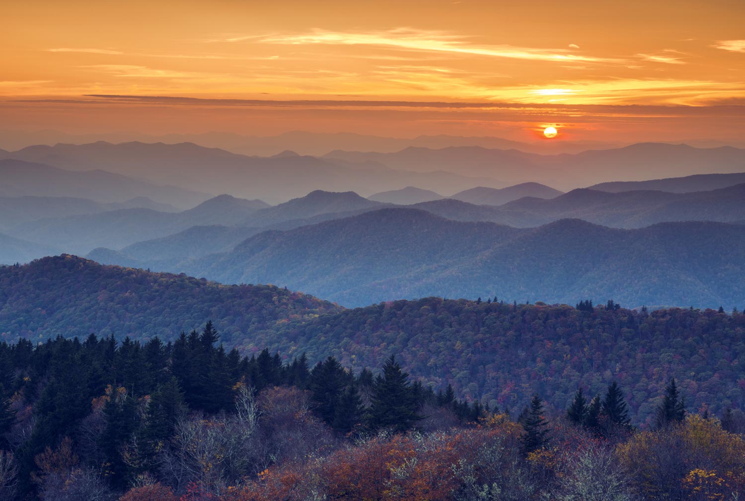 Aerial view of an orange sunset over the blue ridge