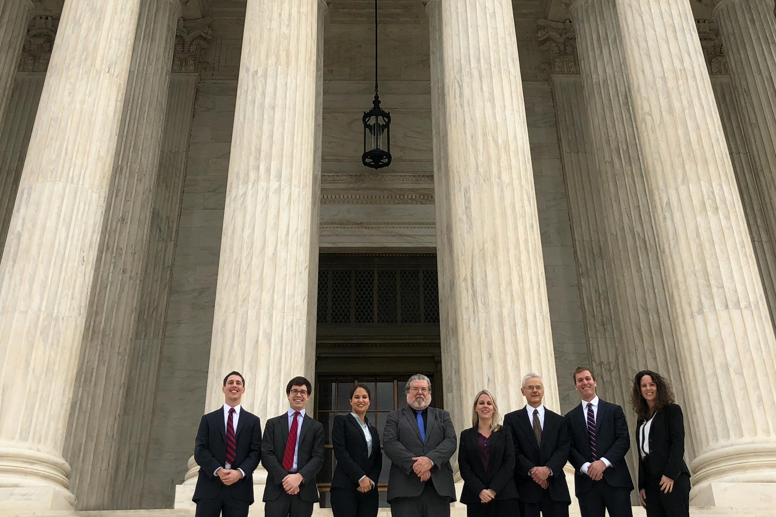 Members of UVA Law’s Supreme Court Litigation Clinic pose together on the Steps of the US Supreme Court