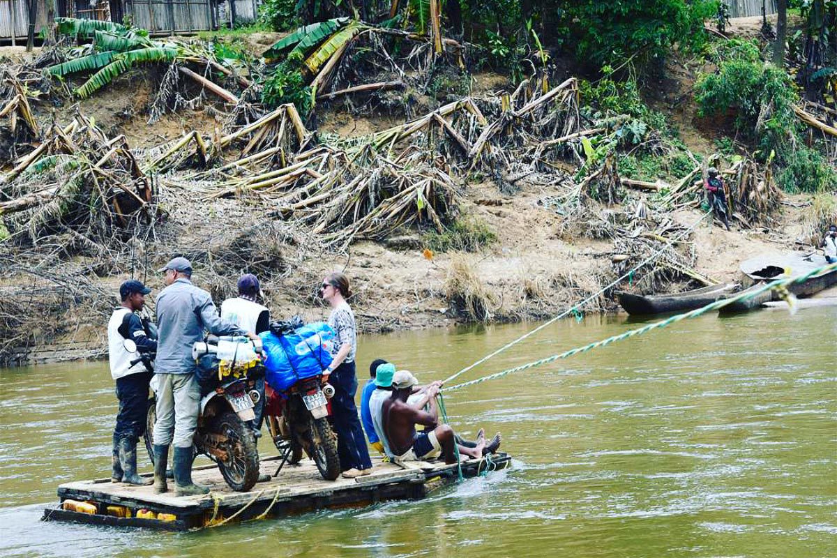 People on a raft in the Madagascan water as they come to shore